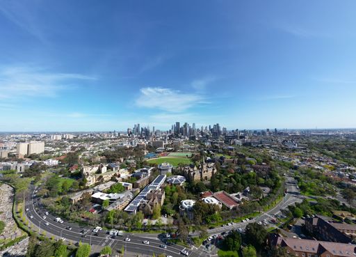 The Melbourne University view with the urban skyline on sunny day, aerial, drone