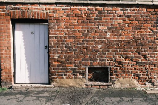 A gateway to the back of the old Victorian houses on a sunny day
