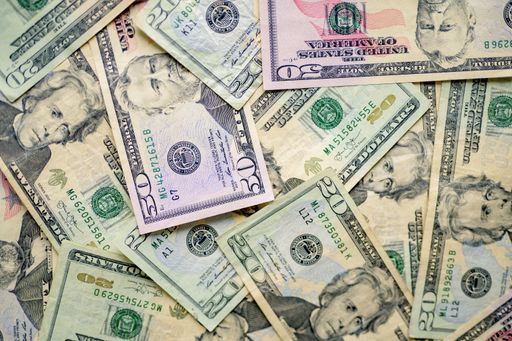 An overhead shot of different types of dollar bills on top of each other - great for background