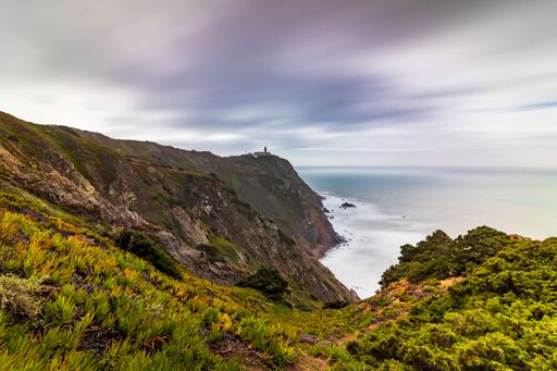 A drone shot long exposure of the beautiful Cabo da Roca cape and beach in Lisbon, Portugal