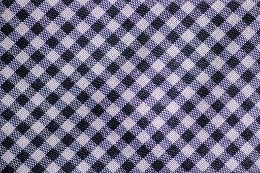 A closeup shot of a white and black tie - great for background