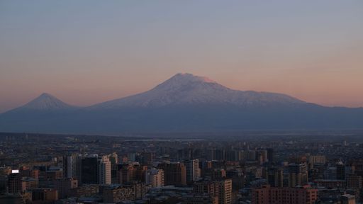 A beautiful shot of the Mount Ararat over the Yerevan skyline at sunset in Armenia