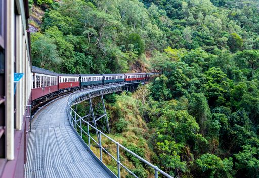 A beautiful shot of Kuranda scenic railway surrounded by green tree forests in Australia
