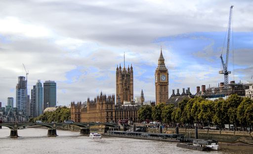 A scenic view of bridge on the river Thames with Big Ben and other buildings on the background