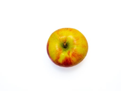 Birds eye view at delicious fresh apple isolated on white background as an example for healthy vegetarian nutrition.
