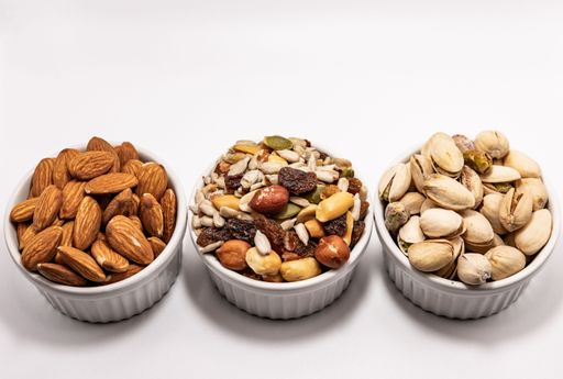 A closeup shot of nuts in bowls