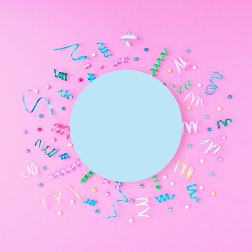 A colorful celebration background with party confetti on pink background with copy space