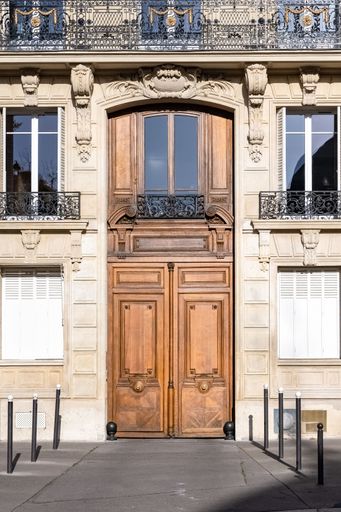 Paris, an ancient wooden door, beautiful facade parc Monceau, in the 8e arrondissement