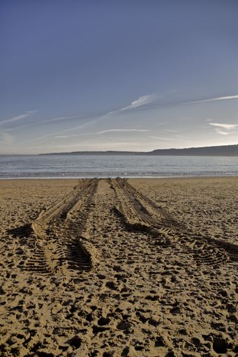A vertical shot of Tracks to nowhere on the beach at Scarborough sea front, North Yorkshire, England