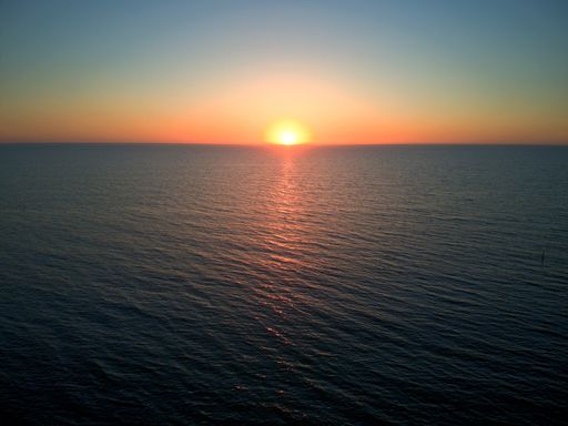 A scenic view of sunset over a tranquil sea