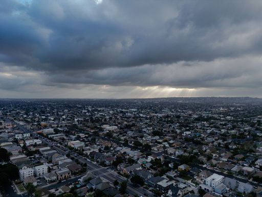 An aerial view of a stormy dark sky over the skyline of Los Angeles, USA