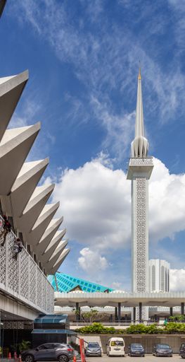The 73 metre tall minaret of the National Mosque of Malaysia towers above the green tile roof of the main assembly hall.