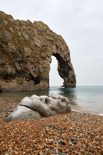 A vertical shot of Durdle Door in the sea in Dorset, England