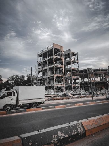 A vertical shot of ruins of destroyed buildings after bombing in AlWafoud Street in Basra lraq