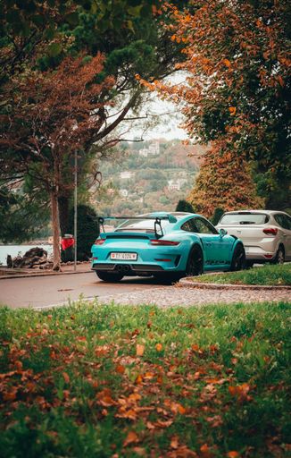 A vertical shot of a Porche car at the Como lake in Milan, Italy