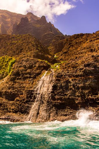 A vertical shot of the spectacular Na Pali coast cliffs on Kauai island, Hawaii during daylight