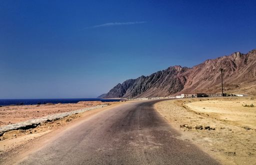 A road surrounded by mountains