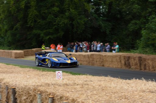 A Ferrari Formula 1 car going up the hill climb