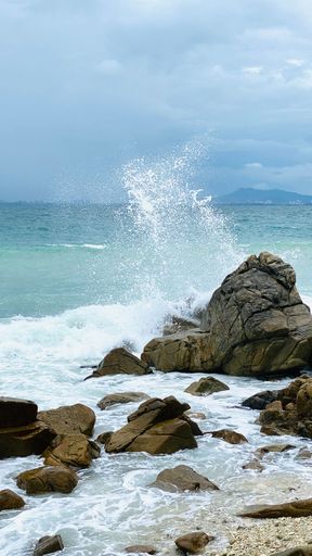A beautiful seascape view in Sanya, China on Wuzhizhou island in daylight - a vertical shot