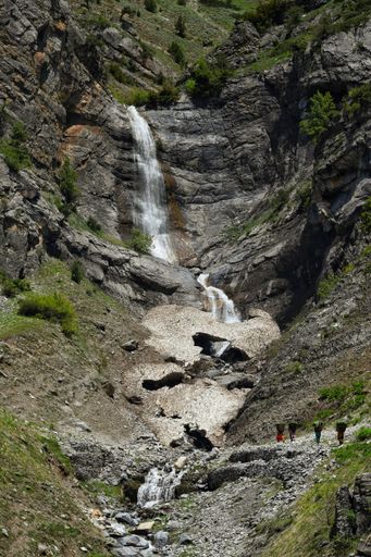 A vertical shot of a rocky waterfall