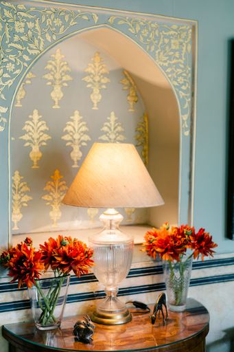 A vertical shot of multiple vintage themed home decorations in pastel colors