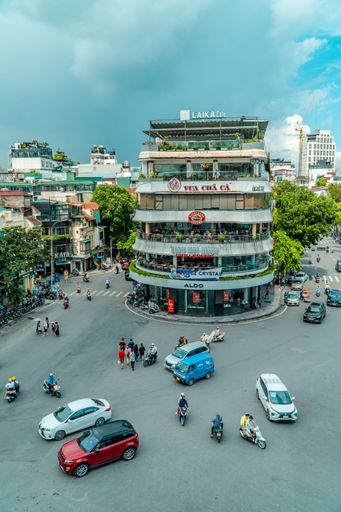 A vertical aerial shot of a busy roundabout in the Old Quarter of Hanoi