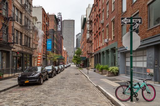 View along a cobblestone street in the Seaport area of Manhattan Island, New York City.