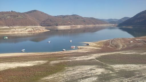An aerial view of Kokin brod lake surrounded by hills