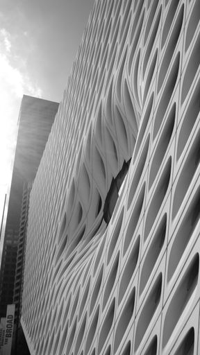 A vertical grayscale shot of the exterior of Broad Art Museum in Los Angeles, California