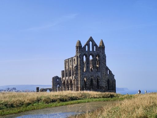 A scenic view of the ruins of Whitby Abbey monument located in Whitby, England