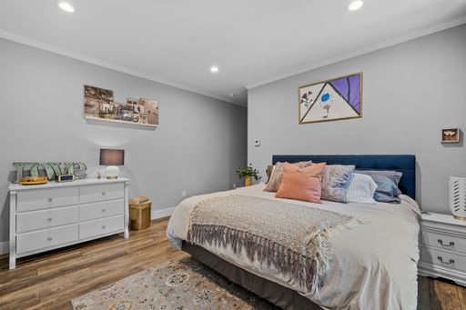 The beautiful interior design of a bedroom in a modern custom new England colonial home