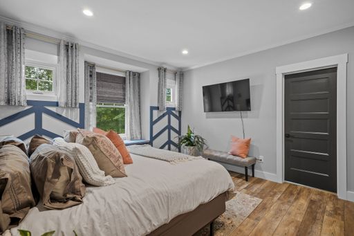 The beautiful interior design of a bedroom in a modern custom new England colonial home