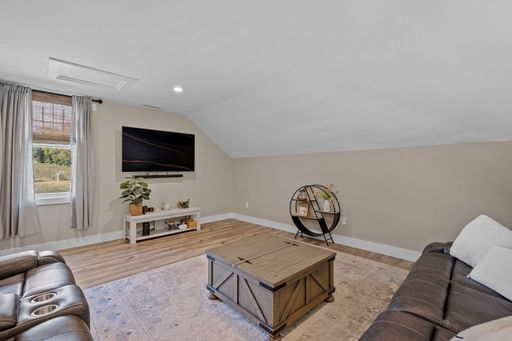 The beautiful interior design of a second floor lounge area in a modern new England colonial home