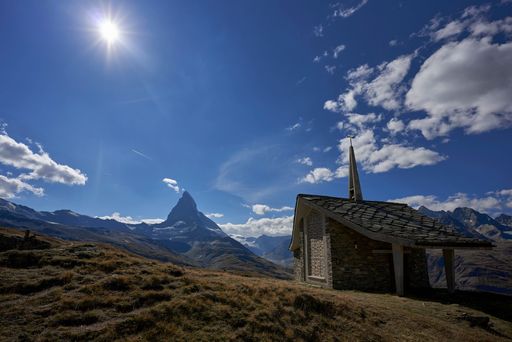 The Bruder Klaus chapel in Riffelberg Switzerland with the Matterhorn mountain in the background on a sunny day