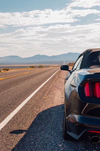 A vertical shot of a car on a road