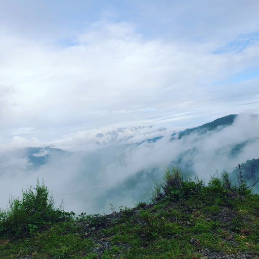 A scenic view of sea of clouds seen from the top of a mountain