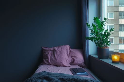 The laptop on the bed. Work from home in a cozy Scandinavian apartment in Stockholm, Sweden.