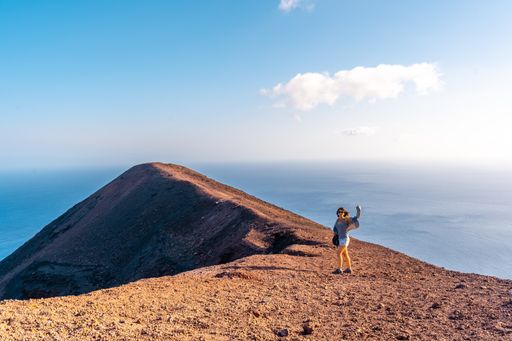 A female exploring Teneguia volcano on the island of La Palma, Canary Islands, Spain