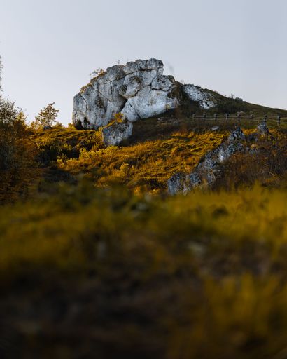 A vertical shot of the rocks surrounded by autumn colors, Silesia, Kromolowiec Hill