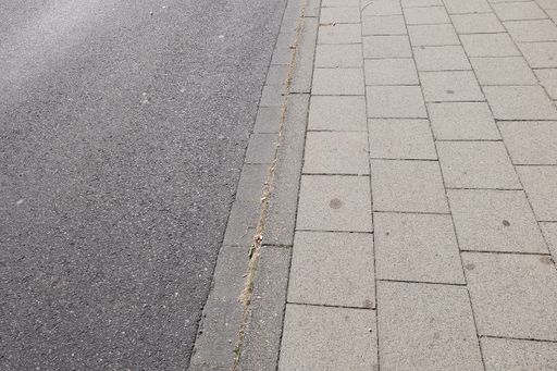 A high angle shot of grey-tiled ground