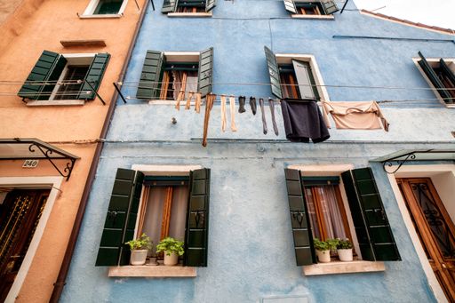A low angle shot of lovely colorful buildings in Burano Island, Venice, Italy