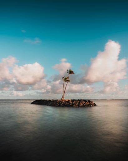 A vertical shot of a sea at a cloudy day