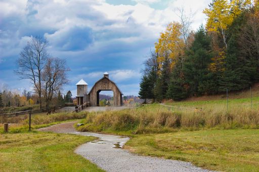 A small wooden arch on the pathway in Parc Omega in Notre-Dame-de-Bonsecours, Quebec, Canada