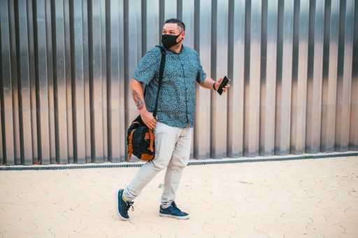 A European man with protective mask on his way to work