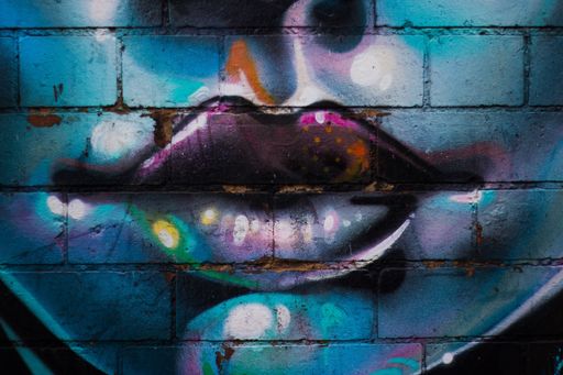 A beautiful shot of an illustration of female lips on a wall