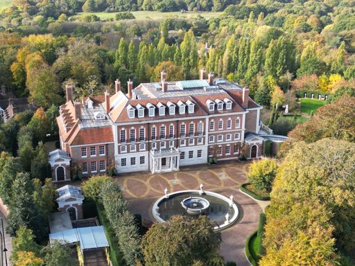 The aerial view of the Witanhurst Mansion building and garden on an autumn day
