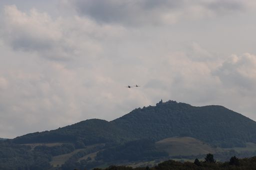 A beautiful shot of two jets flying in the mountains of Hahnweide in Germany under the cloudy sky