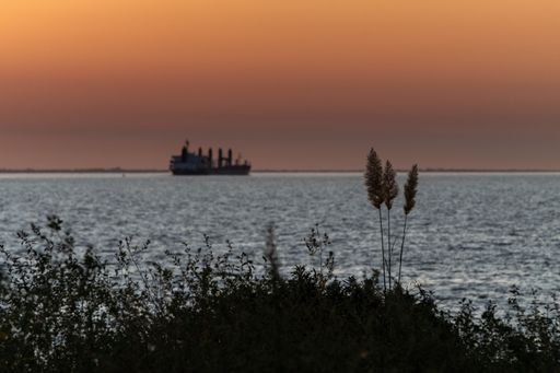 A cargo ship at sunset at Uruguay River, Colonia, Uruguay
