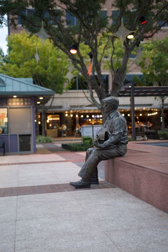 A vertical shot of an old metal statue in Sugar Land Town Square, Texas in daylight