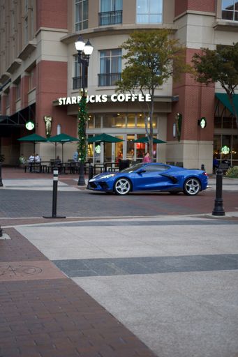 A vertical shot of a Starbucks coffee shop in Sugar Land Town Square in Texas